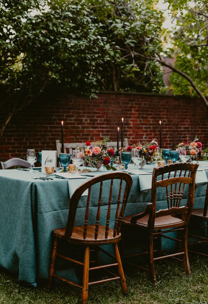 Powel House Wedding Reception | Garnet, oxblood, peach, and blue wedding reception flowers with vintage flowers and black taper candles | Flowers by Love 'n Fresh Flowers | Photo by Chellise Michael Photography