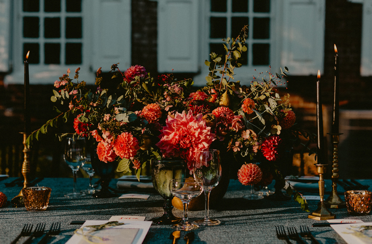 Powel House Wedding Reception | Saturated jewel tones in this autumn wedding centerpiece in a gold bowl overflowing with dahlias and surrounded by taper candles | Philadelphia | Flowers by Love 'n Fresh Flowers | Photo by Chellise Michael Photography