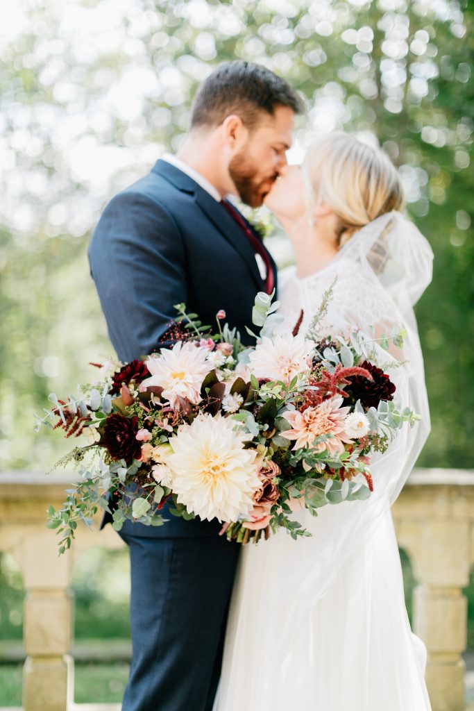 Parque at Ridley Creek Wedding | Philadelphia | Emilie's autumn seasonal bridal bouquet with dahlias and eucalyptus in shades of blush, cream, burgundy, oxblood, brick red and ebony | Photo by Emily Wren Photography | Flowers by Love 'n Fresh Flowers