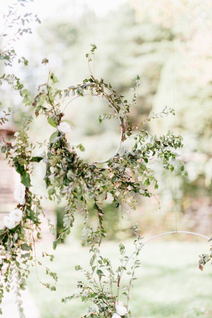 Parque at Ridley Creek Wedding | Philadelphia | Floral hoops with lots of greenery hung as the backdrop at the ceremony | Photo by Emily Wren Photography | Flowers by Love 'n Fresh Flowers