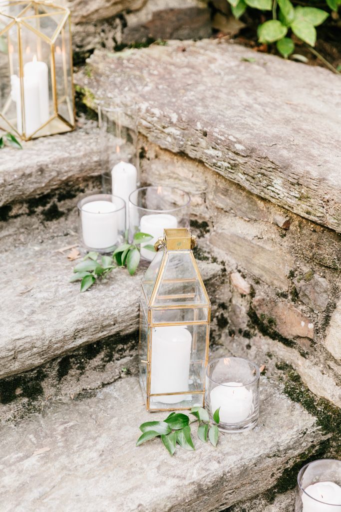 Parque at Ridley Creek Wedding | Philadelphia | Lanterns and candles with greenery on the steps at the ceremony | Photo by Emily Wren Photography | Flowers by Love 'n Fresh Flowers
