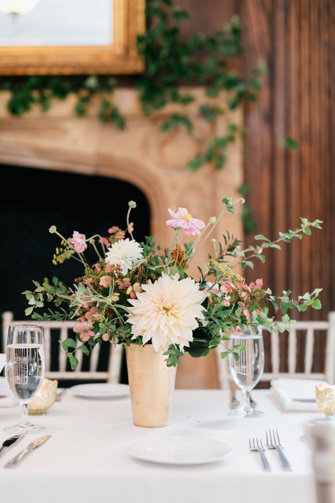 Parque at Ridley Creek Wedding | Philadelphia | Seasonal autumn wedding centerpiece featuring cream dahlias in a gold cup with lots of greens | Photo by Emily Wren Photography | Flowers by Love 'n Fresh Flowers
