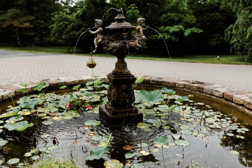 Spring Wedding at the Inn at Barley Sheaf in New Hope PA || Romantic old fountain with water lilies || Photo by Lev Kuperman