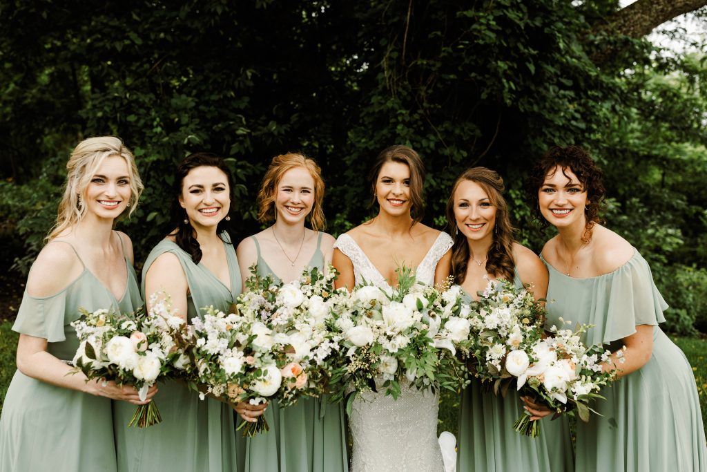 Green and white spring wedding at the Inn at Barley Sheaf || Soft green bridesmaid dresses with white and green bouquets featuring peonies and garden roses with lots of foliage. || Florals by Love 'n Fresh Flowers in Philadelphia || Photo by Lev Kuperman