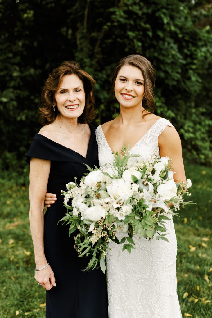 Green and white spring wedding at the Inn at Barley Sheaf || Callee and her mom Bea with her dramatic lush white and green cascading bridal bouquet featuring heaps of our farm's white peonies. || Florals by Love 'n Fresh Flowers in Philadelphia || Photo by Lev Kuperman