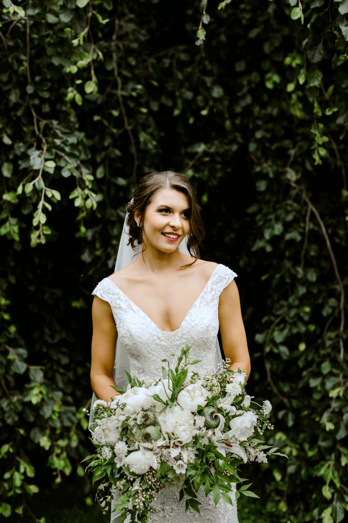 Green and white spring wedding at the Inn at Barley Sheaf || Callee with her dramatic lush white and green cascading bridal bouquet featuring heaps of our farm's white peonies. || Florals by Love 'n Fresh Flowers in Philadelphia || Photo by Lev Kuperman