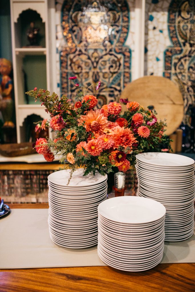Flowers on the buffet at the wedding. | Material Culture Colorful Same-Sex Wedding | Philadelphia | Sustainable Wedding Flowers by Love 'n Fresh Flowers | Photo by Peach Plum Pear Photography