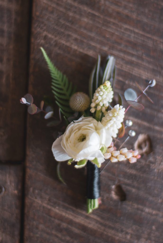 Horticulture Center Spring Wedding || Groom's boutonniere with ranunculus, muscari, and pieris || Flowers and photo by Love 'n Fresh Flowers